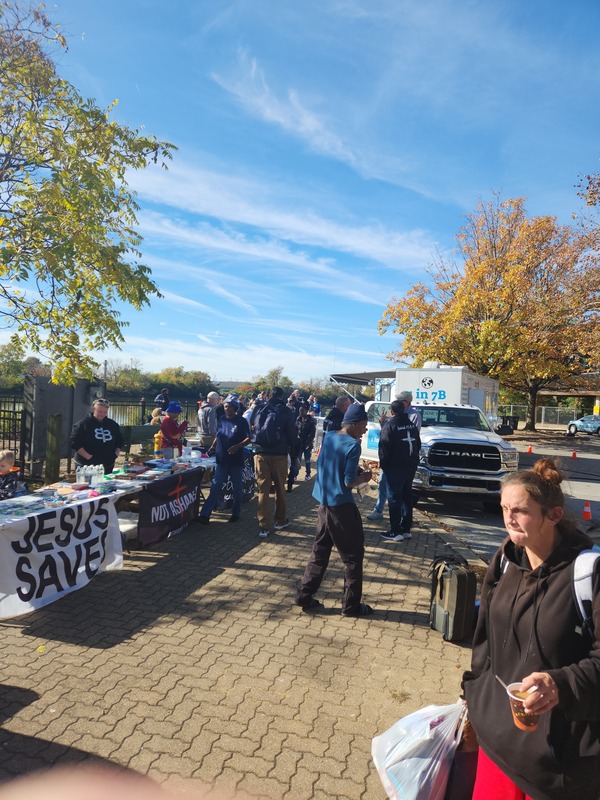 Caregiverers event providing food and clothing at the Waterfront, in Wilmington, Delaware. Jesus Saves!